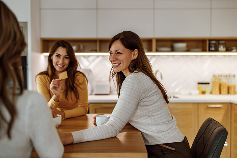 Friends Chatting Kitchen Table